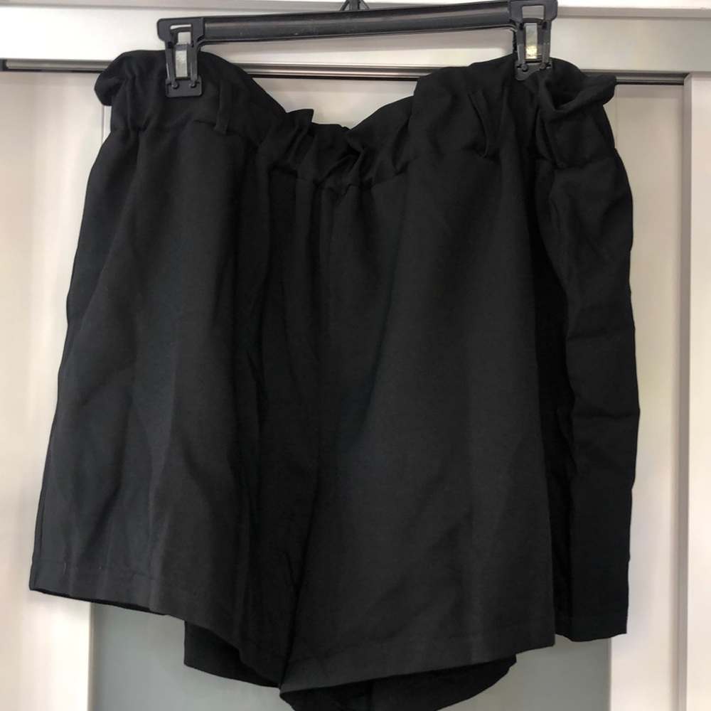 Never worn! Black shorts. Ruched top with belt loops.